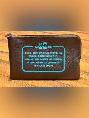 Like New - Coach “Storypatch” Clutch Pouch in Black/Teal.